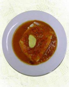 Bacalao en salsa de tomate y pimientos